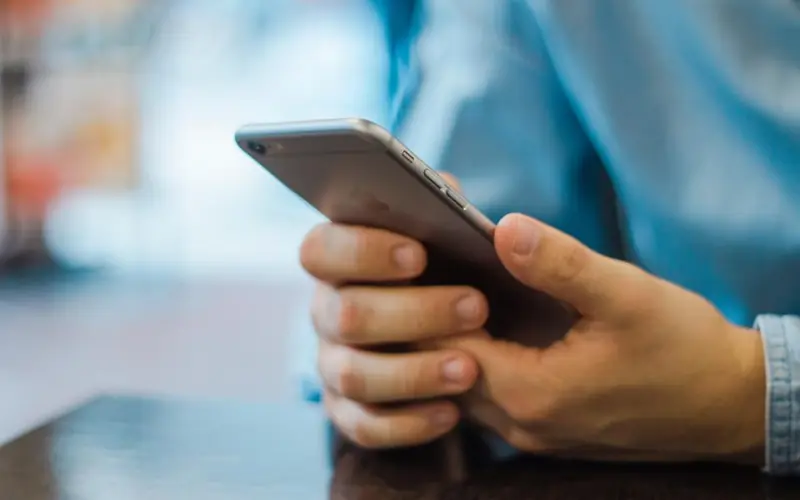 Hands holding a smartphone