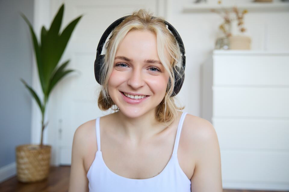 Smiling woman wearing headphones